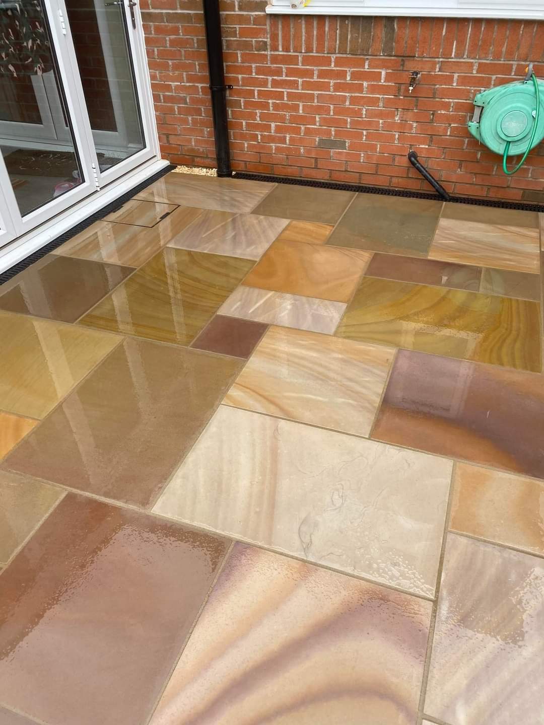 Smooth buff sandstone slabs stacked at the manufacturing unit