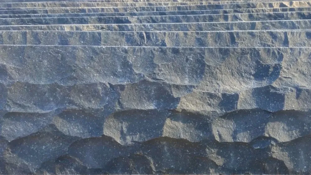 Black basalt stone rockface