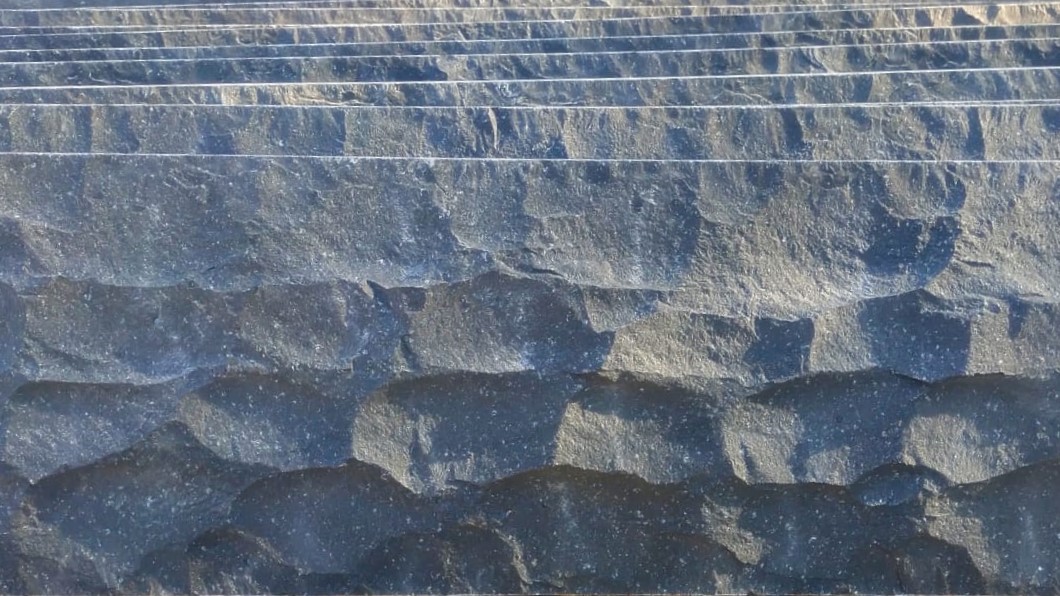 Black basalt stone rockface