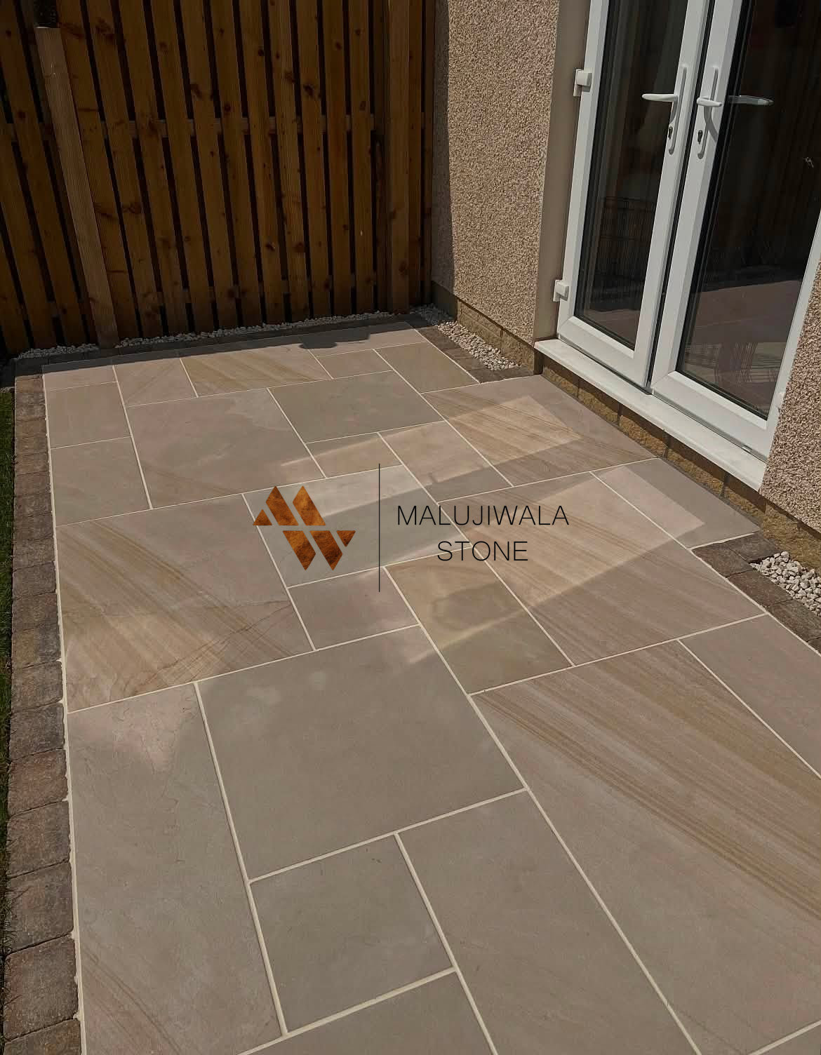 Buff sawn and honed dry patio pack laid in a mixed-size pattern