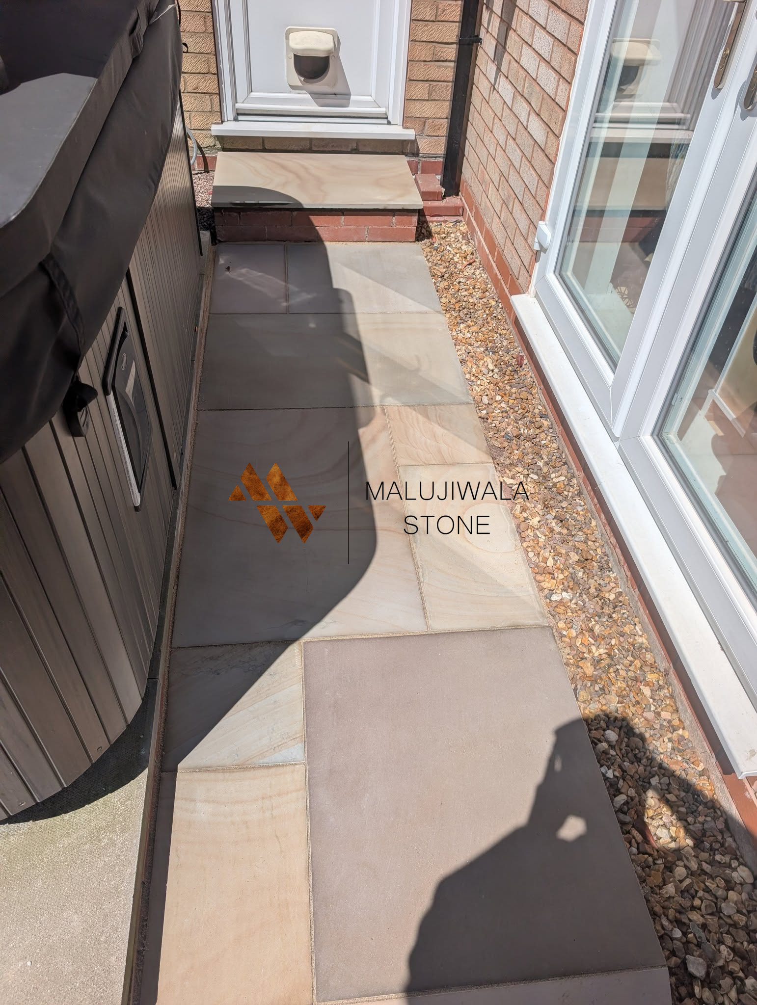 600 x 900 smooth Rippon buff sandstone, wide view of the finished patio