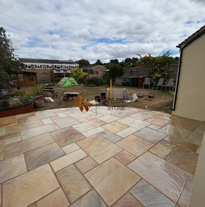 Fossil Mint riven Indian sandstone paving laid as a mix pattern patio