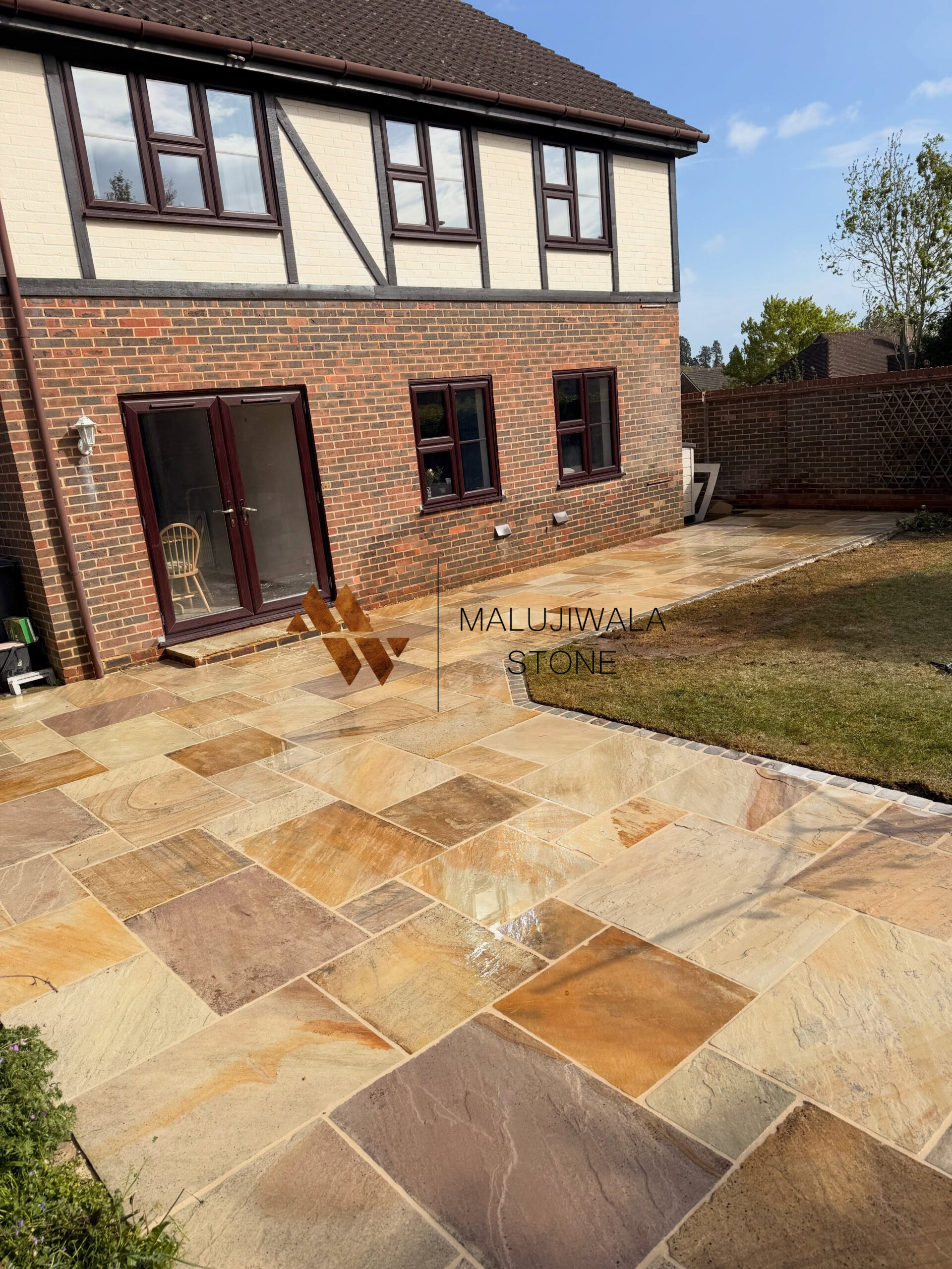Golden fossil sandstone paving slabs with fern and shell impressions