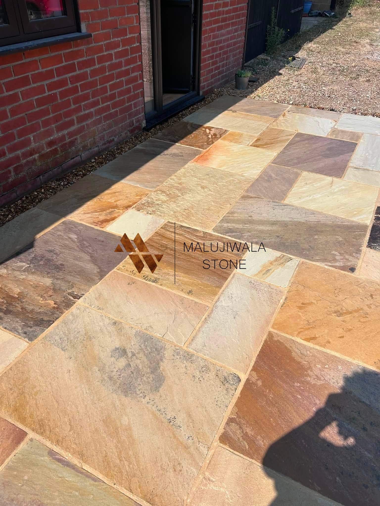 Mint sandstone paving slabs stacked before packing
