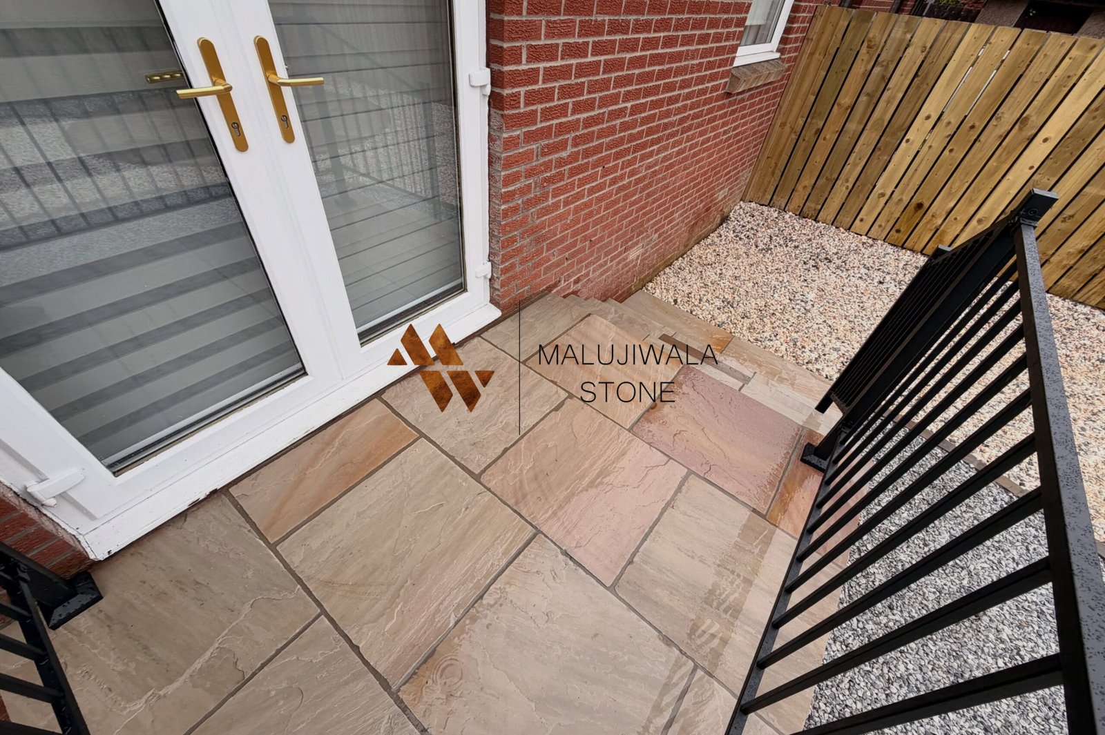 Raveena sandstone paving slab with purple and lilac banding on a riven face