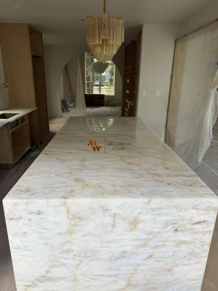 Long Cristallo quartzite island with a thick mitered edge