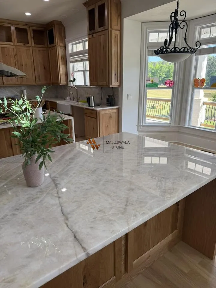 Cristallo quartzite kitchen island beside a bay window